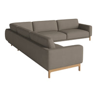 Modern L-shaped sofa in soft taupe upholstery with clean lines and light wooden legs, perfect for contemporary interiors.