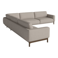 Beige sectional sofa with a textured fabric and sleek brown legs, offering a modern and minimalist design.