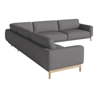 Gray sectional sofa with a modern, minimalist design and light wood legs, featuring a solid color upholstery.