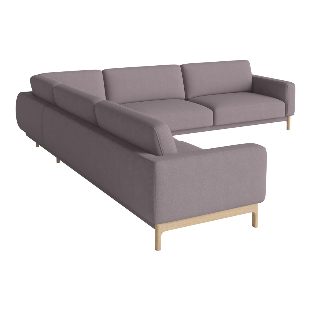 Light gray sectional sofa with a minimalist design and smooth fabric texture, complemented by wooden legs.