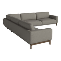 Gray sectional sofa with a sleek design and subtle fabric texture, featuring modern wooden legs.