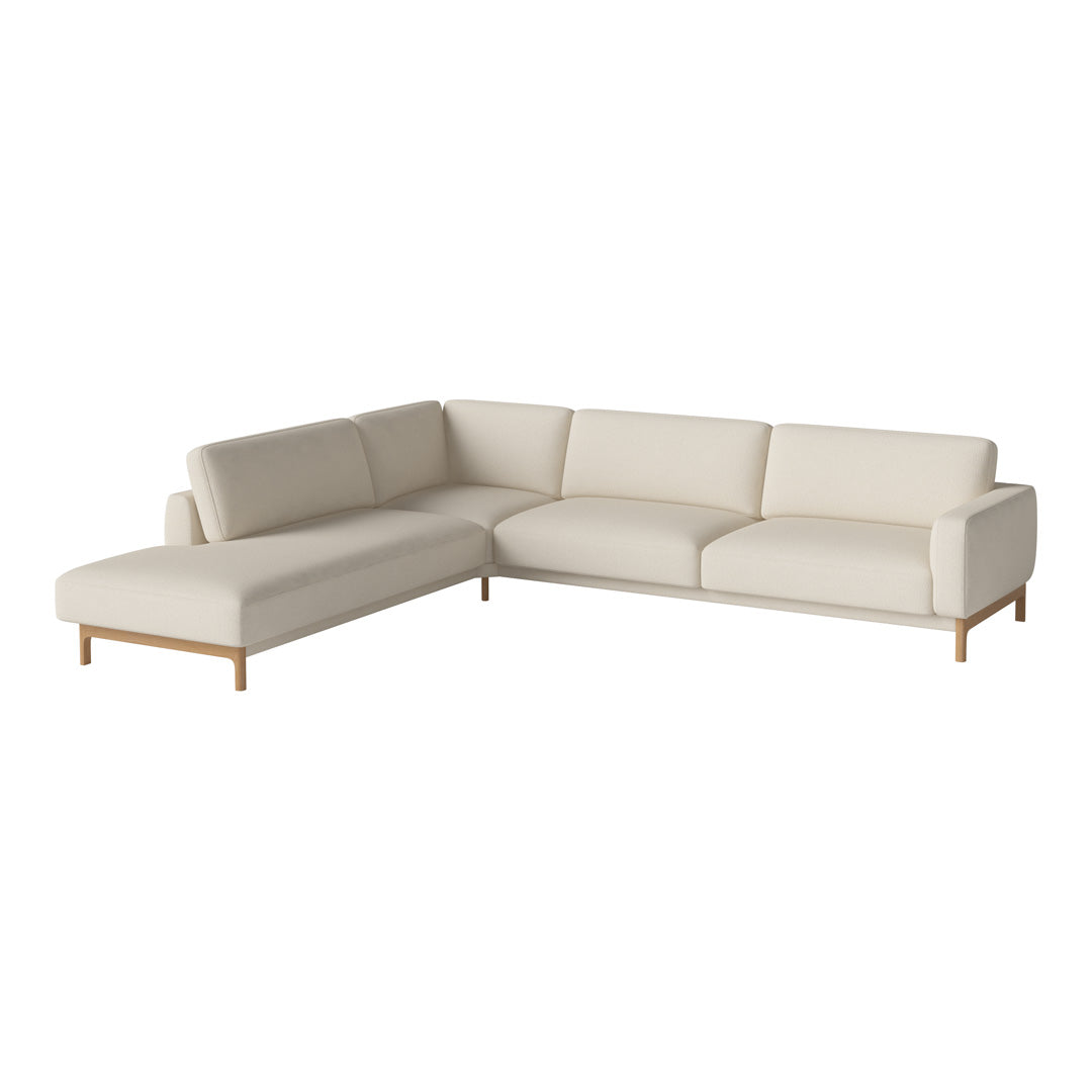 Luxe beige sectional sofa with smooth upholstery and light wooden legs, perfect for modern living spaces.