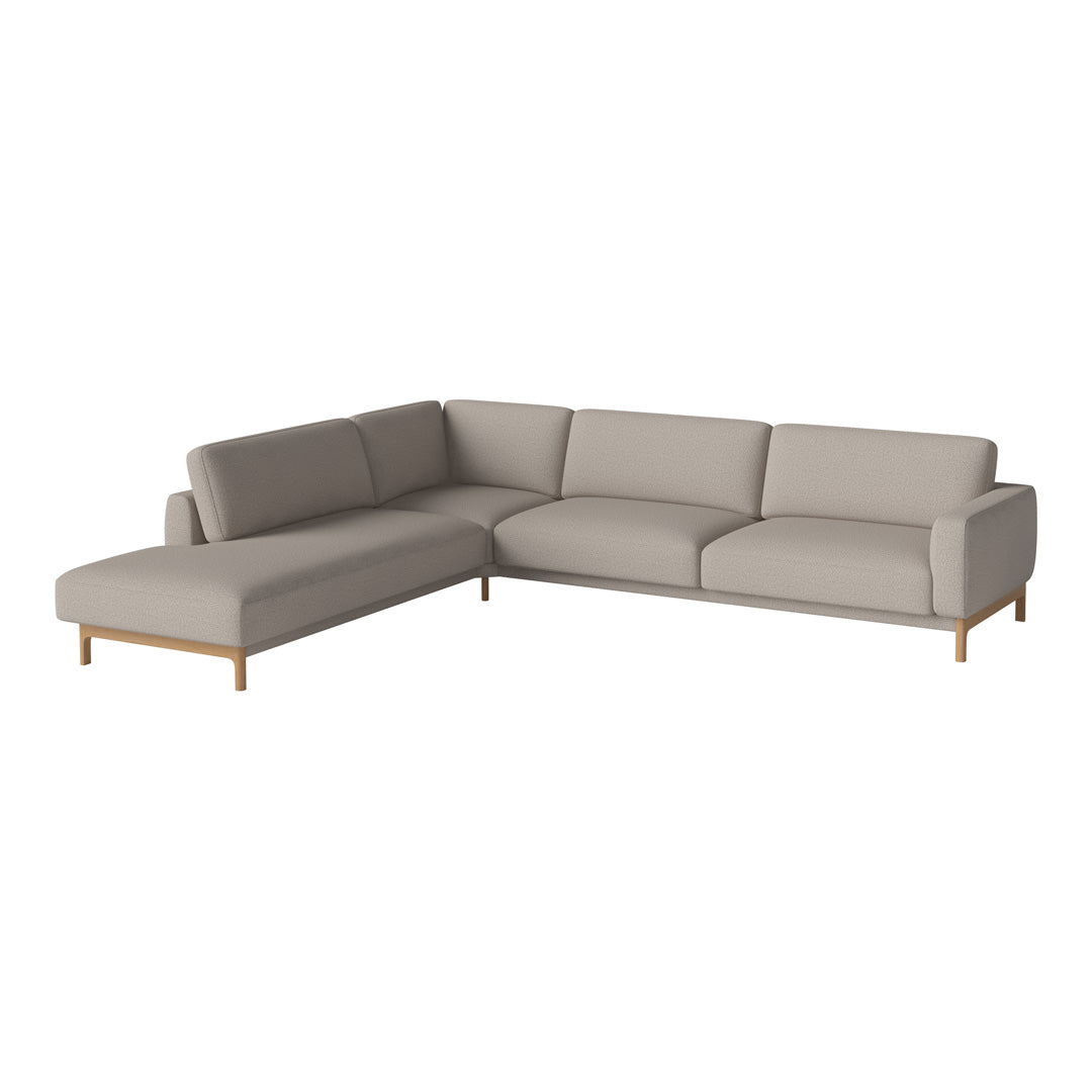Beige sectional sofa with clean lines and a modern design, featuring soft upholstery and natural wood legs.