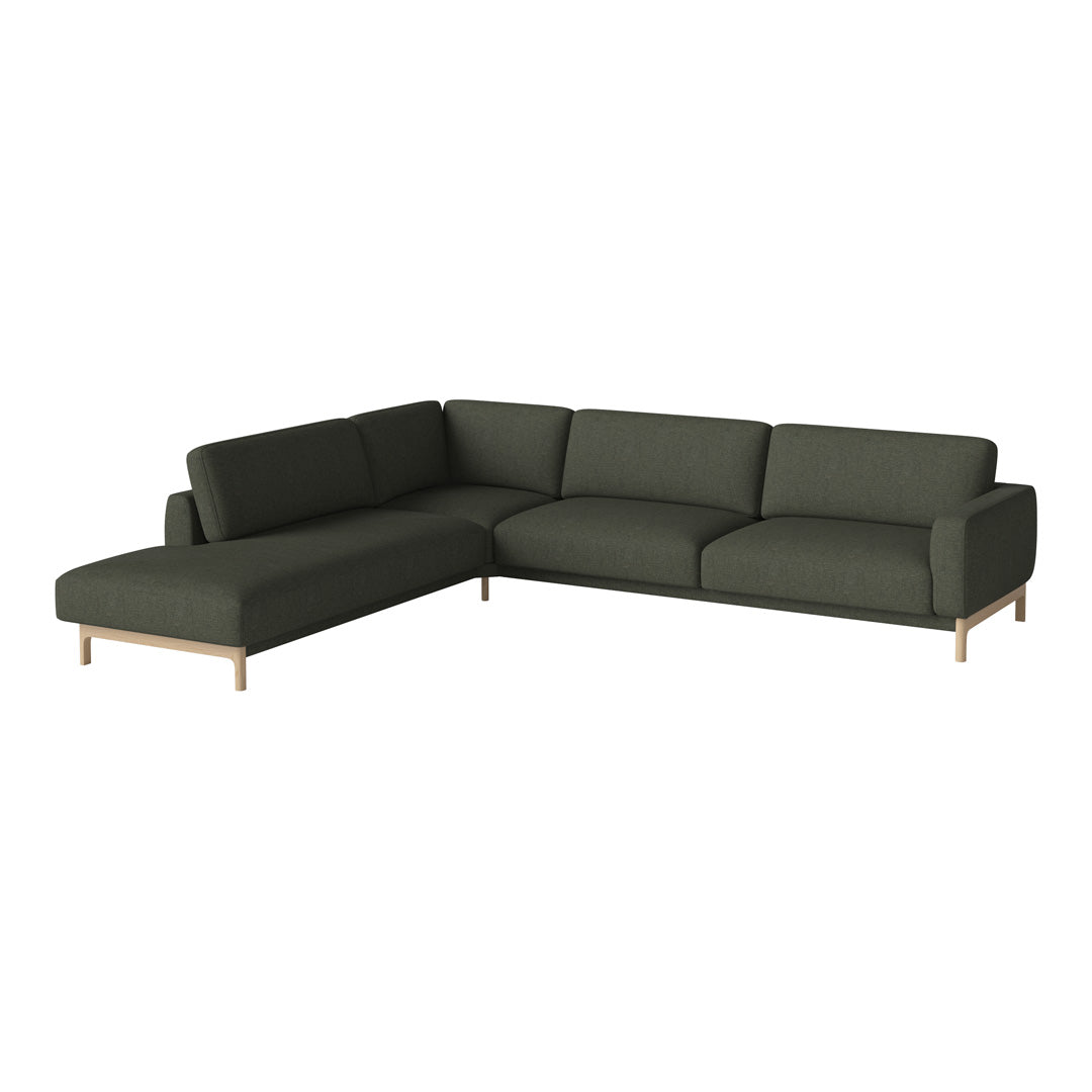 Stylish dark green sectional sofa with smooth, modern lines and natural wood legs for elegant decor.
