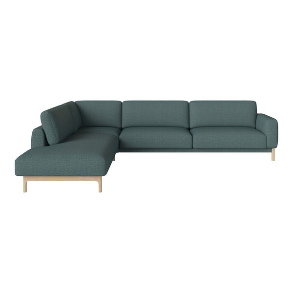 Teal sectional sofa with a clean, modern design and light wood legs, perfect for contemporary living spaces.