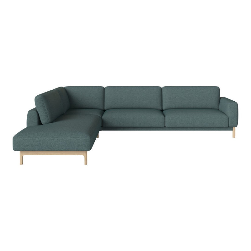 Teal sectional sofa with a clean, modern design and light wood legs, perfect for contemporary living spaces.