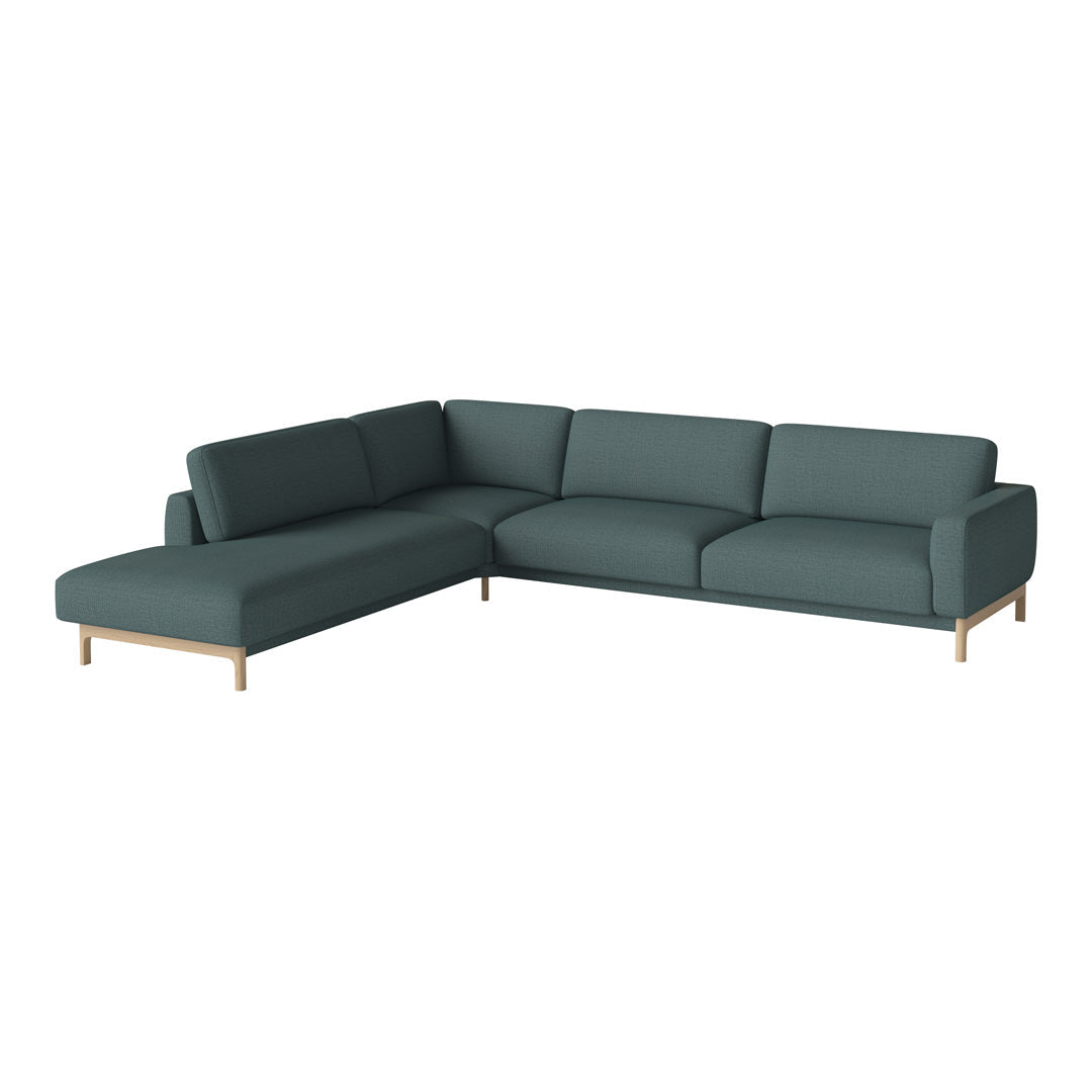 Modern dark green sectional sofa with smooth fabric and light wooden legs, perfect for contemporary living spaces.