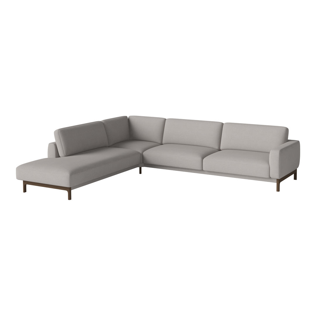 Light gray sectional sofa with smooth fabric and minimalist design, featuring simple, elegant lines.