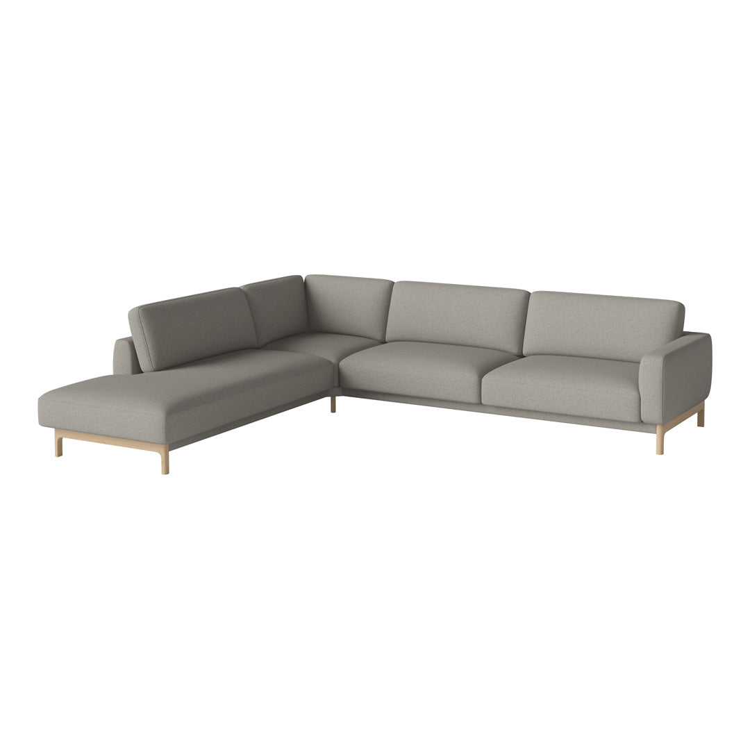 Light gray sectional sofa with a smooth, modern design and wooden legs, perfect for contemporary living rooms.
