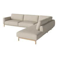 Beige sectional sofa with minimalist design and light wood legs, offering a neutral and modern aesthetic for any space.