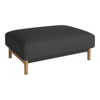 Charcoal gray upholstered ottoman with natural wooden legs, simple and modern design. Ideal for minimalist decor.