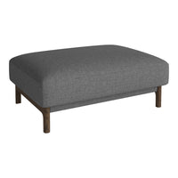 Gray upholstered ottoman with a smooth texture and wooden legs, featuring a minimalist design for modern decor.