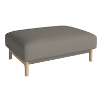 Gray upholstered ottoman with clean lines and light wood legs, featuring a minimalist design and soft texture.
