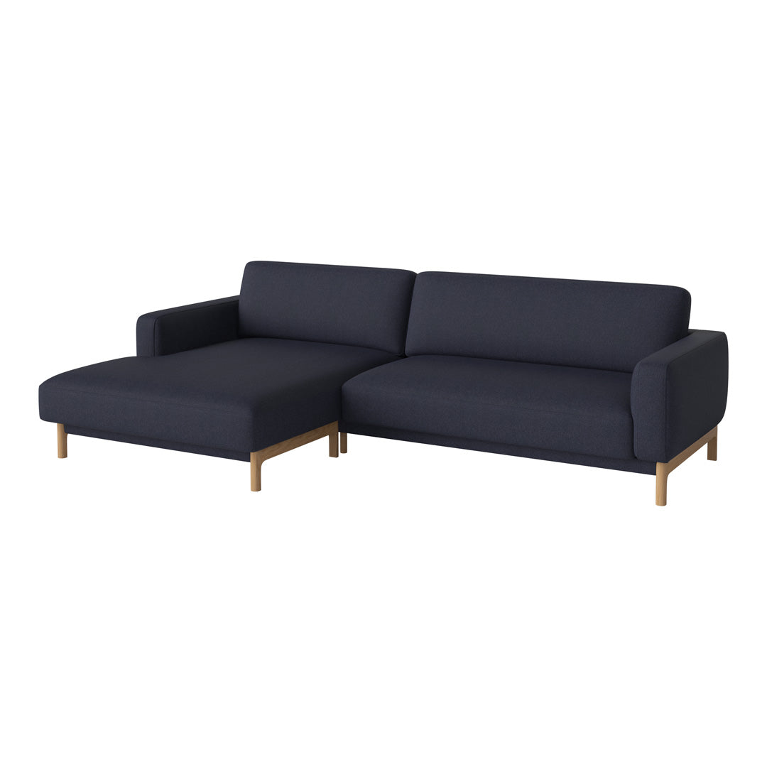 Navy blue sectional sofa with a sleek design and light wooden legs, perfect for modern interiors.