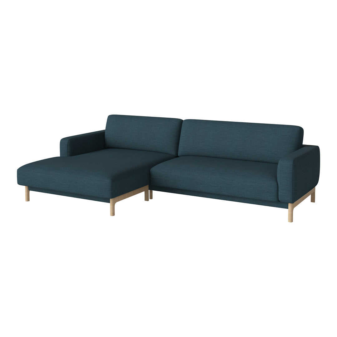Dark teal sectional sofa with a smooth texture and light wooden legs, perfect for modern living spaces.