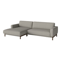 Light gray sectional sofa with smooth fabric and minimalist design, featuring a sleek wooden base.
