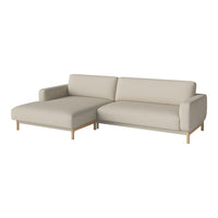 Beige sectional sofa with a smooth fabric finish and light wood legs, perfect for contemporary interiors.