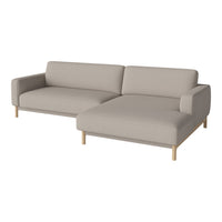 "Light beige modern sectional sofa with simple lines and natural wood legs."