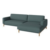 Teal fabric sectional sofa with clean lines and wooden legs, featuring a simple, modern design. Ideal for contemporary spaces.