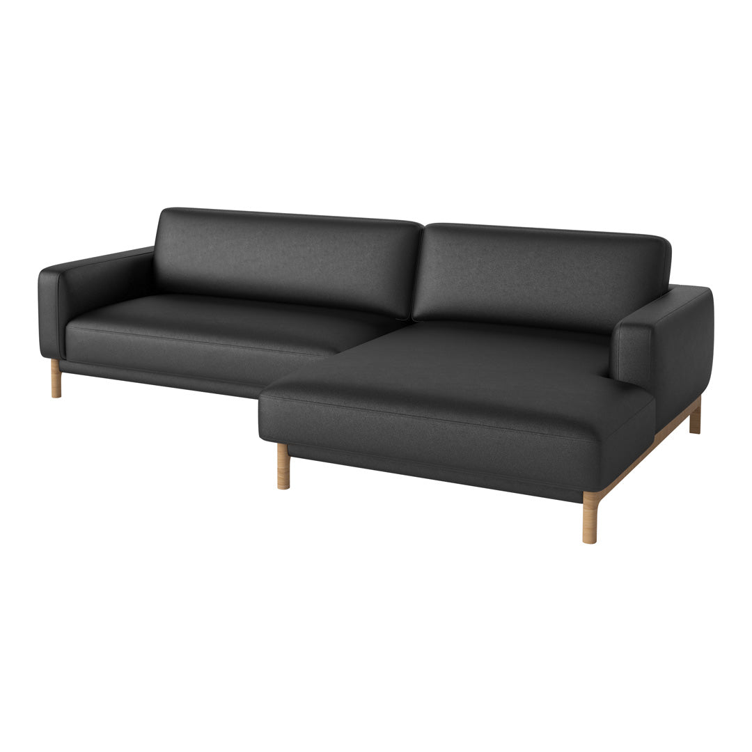Black fabric sectional sofa with wooden legs, featuring a sleek, modern design and smooth, minimalist lines.