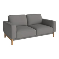 Gray upholstered sofa with smooth fabric and clean lines, featuring light wood legs for a modern touch.