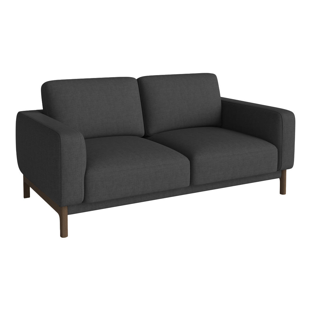 Modern dark gray sofa with a sleek design and smooth fabric, featuring minimalist styling and contrasting wooden legs.