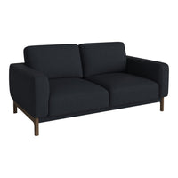 Modern dark grey sofa with a sleek, minimalistic design and smooth upholstery, featuring wooden legs.