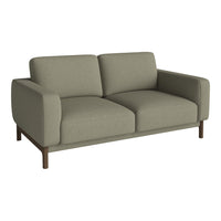 Stylish light gray sofa with clean lines and textured fabric, complemented by a sleek wooden base.