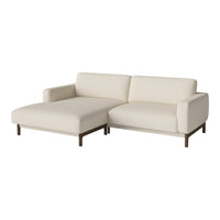 Modern cream sofa with clean lines and a sleek, minimalist design, featuring a solid wood frame.
