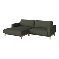 Modern dark green sectional sofa with clean lines and light wood legs, perfect for contemporary living spaces.