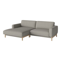 Light gray L-shaped sofa with modern design and smooth fabric, featuring a clean, minimalist look.