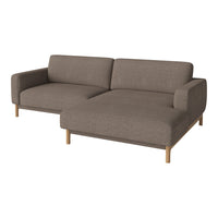 Brown fabric sectional sofa with a modern design and wood legs, featuring a smooth, solid color pattern.