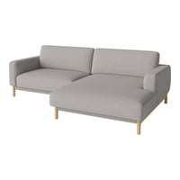 Light gray fabric sectional sofa with clean lines and wooden legs, perfect for modern living spaces.