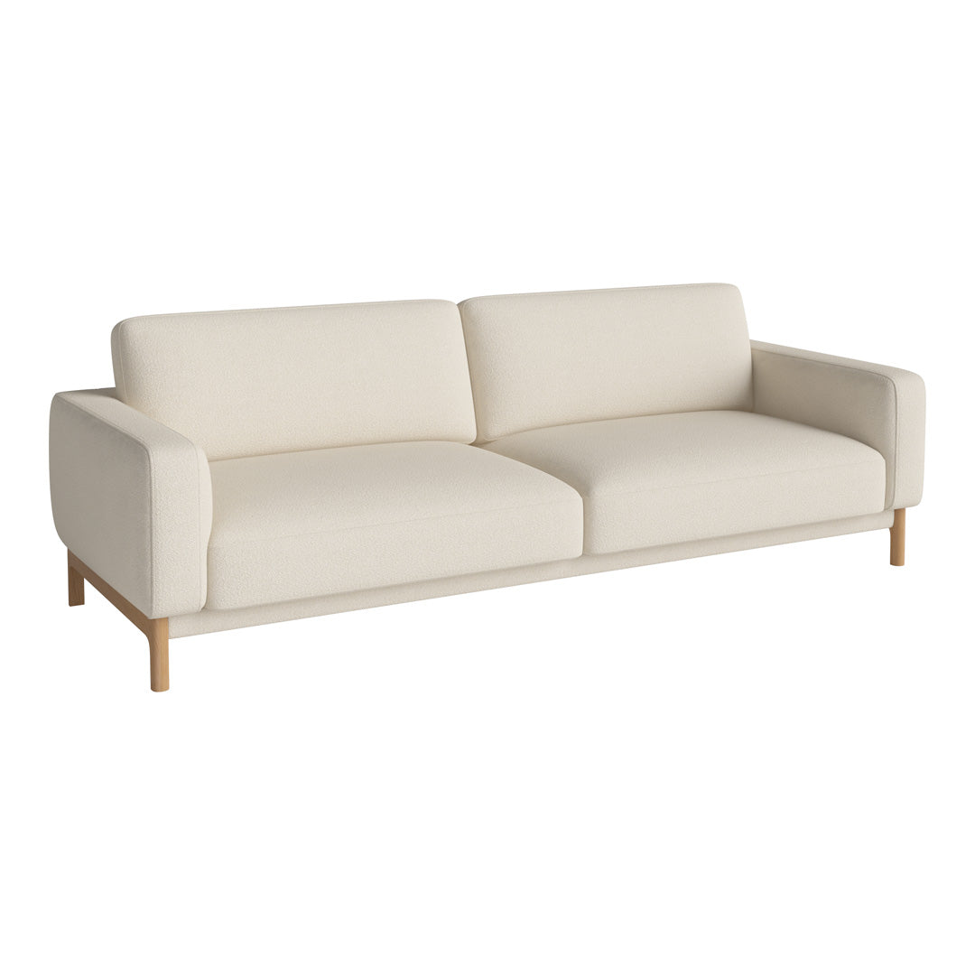 Cream-colored modern sofa with clean lines and a minimalist design, featuring soft fabric and natural wood legs.