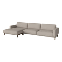 Light beige sectional sofa with smooth upholstery and modern wooden legs, perfect for minimalist decor.