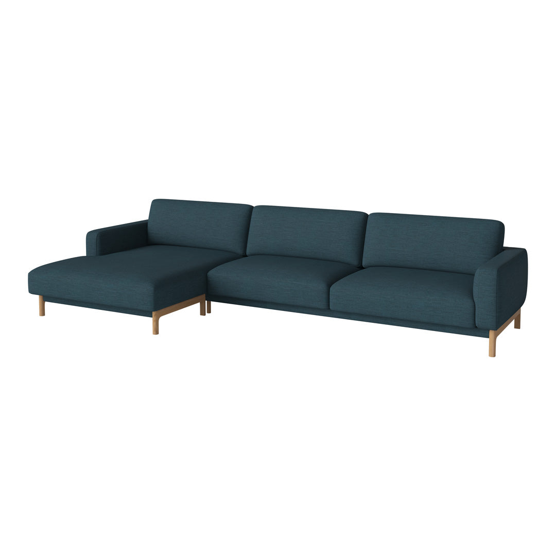 Teal upholstered sectional sofa with minimalist design and light wood legs, perfect for modern living spaces.