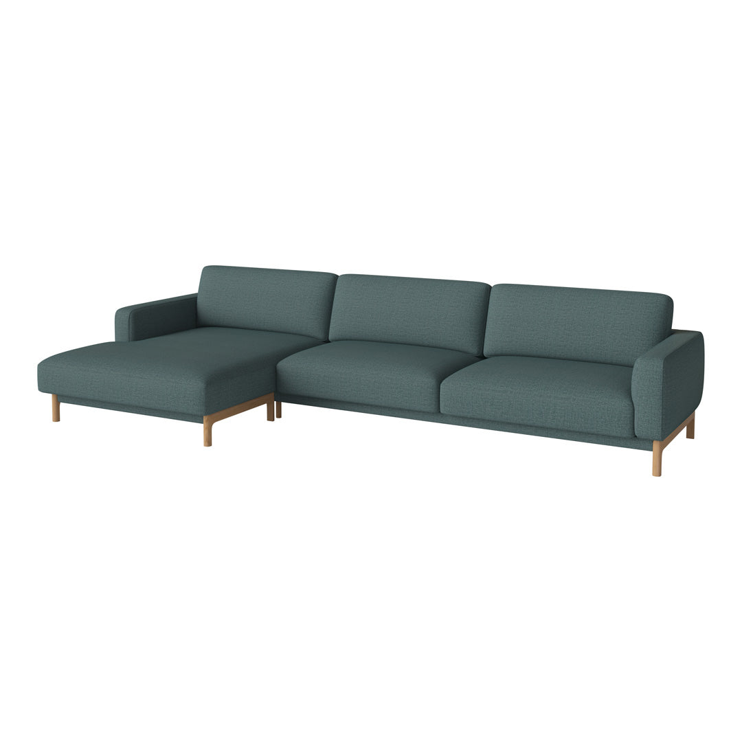 Teal fabric sectional sofa with sleek lines and wooden legs, perfect for modern living spaces.
