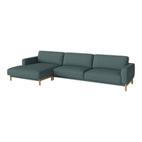 Teal fabric sectional sofa with sleek lines and wooden legs, perfect for modern living spaces.