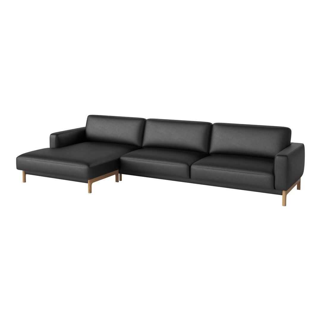 Stylish black sectional sofa with smooth upholstery and light wooden legs, perfect for modern interiors.