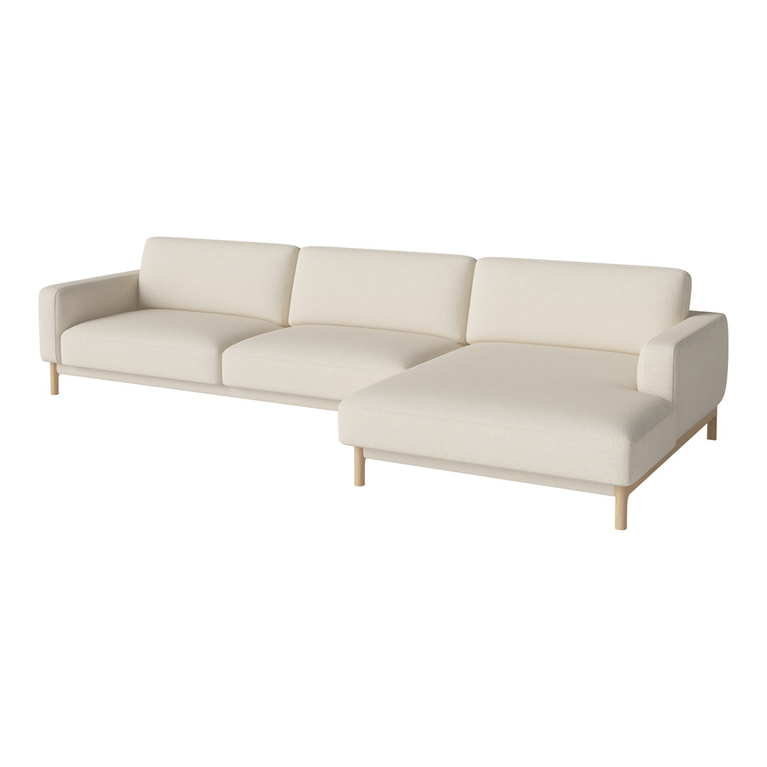 Beige sectional sofa with a minimalist design and soft fabric, featuring a light wood base. Perfect for modern decor.