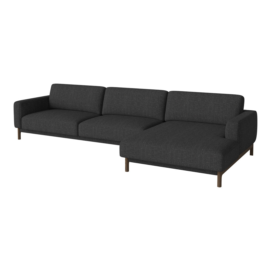 Modern dark gray sectional sofa with clean lines and subtle texture on a minimalist design. Perfect for contemporary decor.
