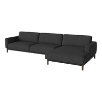 Modern dark gray sectional sofa with clean lines and subtle texture on a minimalist design. Perfect for contemporary decor.