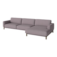 Modern L-shaped sofa in soft grey fabric with sleek wood legs, perfect for contemporary living spaces.