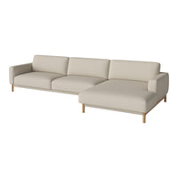 Cream sectional sofa with a minimalist design and light wood legs, featuring smooth upholstery and clean lines.