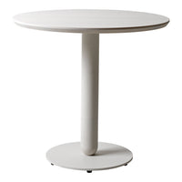 Round white dining table with a smooth finish and a minimalist design, featuring a solid circular base.