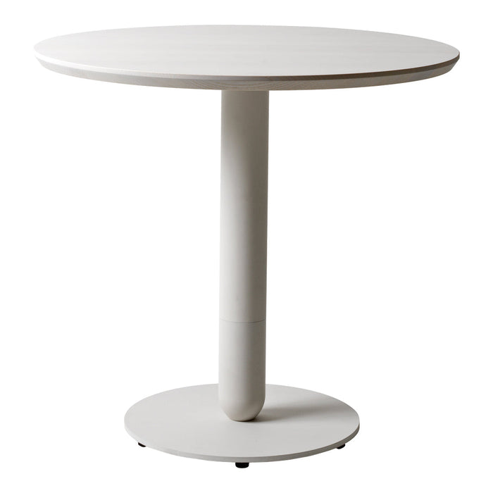 Round white dining table with a smooth finish and a minimalist design, featuring a solid circular base.