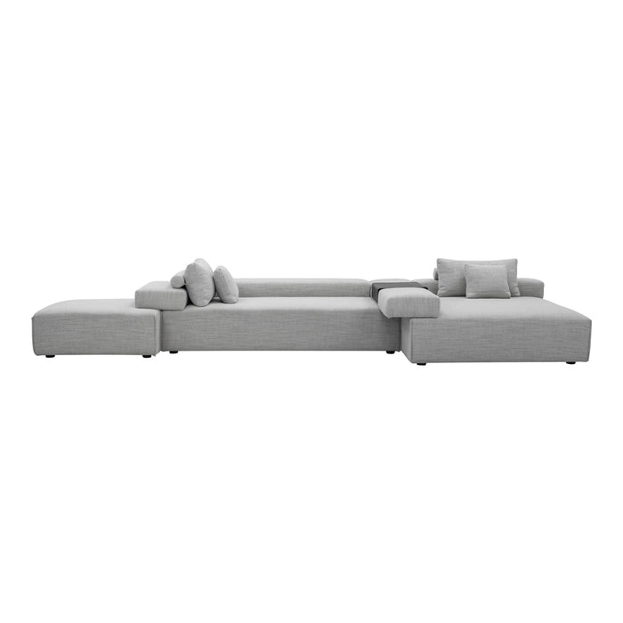 Modern sectional sofa in soft gray fabric with clean lines and minimalistic design. Perfect for contemporary interiors.