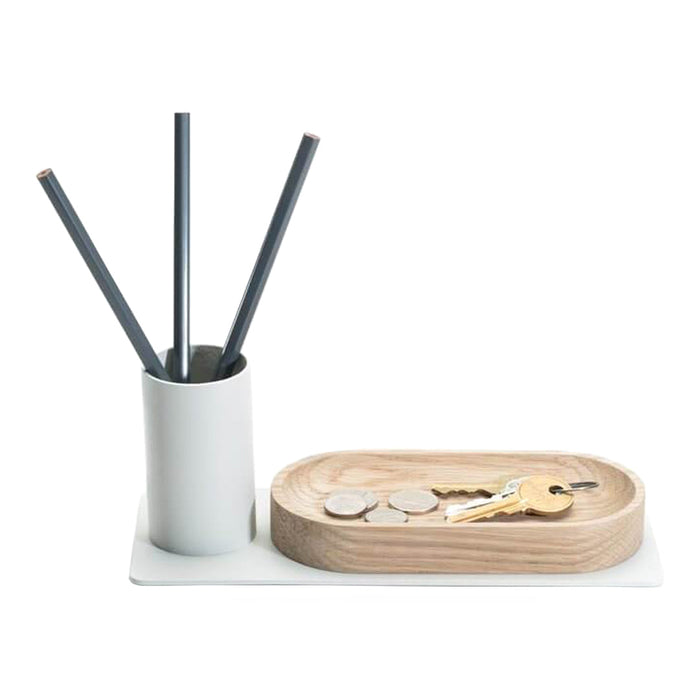 Modern desk organizer in white and natural wood, featuring a cylindrical holder and a smooth oval tray.