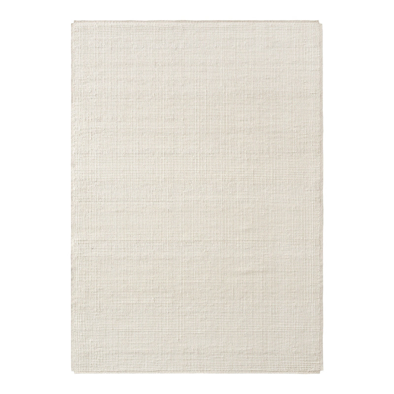 Light beige rectangular rug with a subtle textured pattern, perfect for enhancing any space.