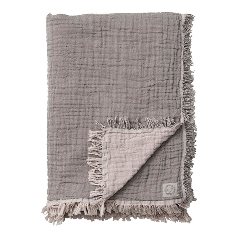 Soft gray blanket with a textured pattern, featuring a contrasting light gray underside and fringed edges.